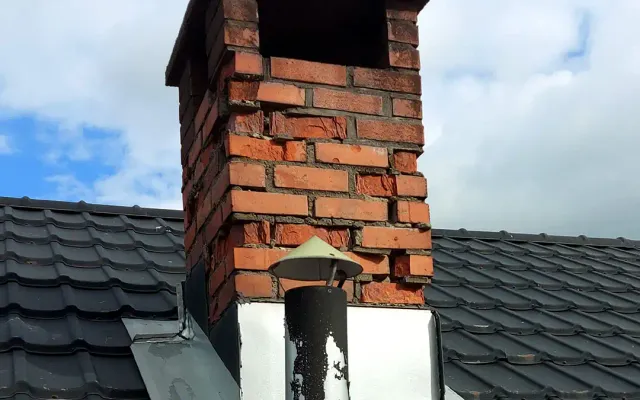 Piperehabilitering med ny fuging og pipehatt